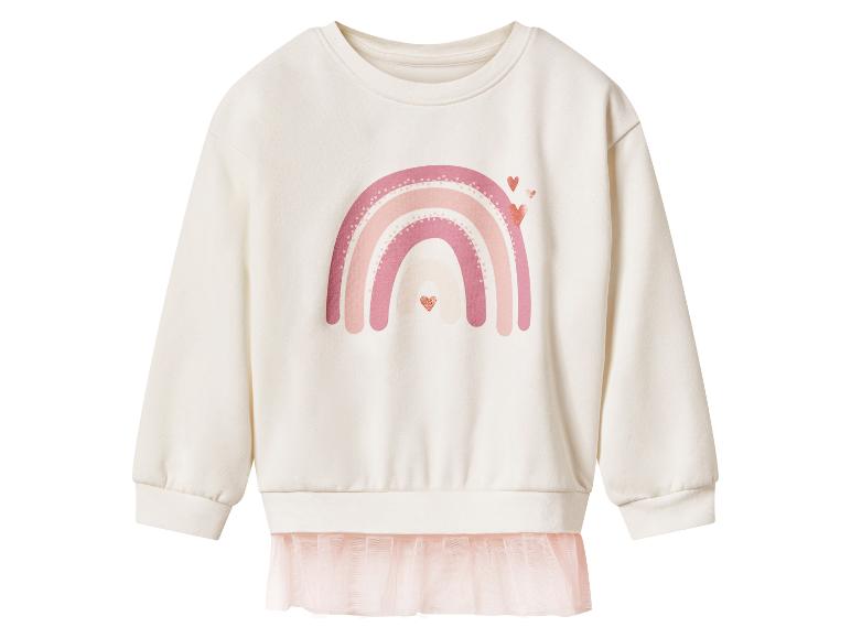 Crèmekleurige longsleeve sweater met roze regenboog en hartjes, met roze tule zoom.