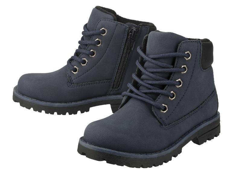 Een paar donkerblauwe veterschoenen met een rits aan de zijkant.