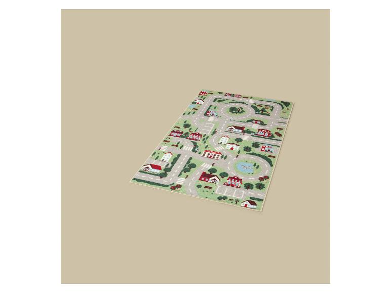 Kinderspeelkleed met een stadsplattegrond, wegen, huizen en bomen.