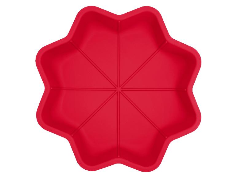 Rode siliconen bakvorm in de vorm van een zevenbladige bloem