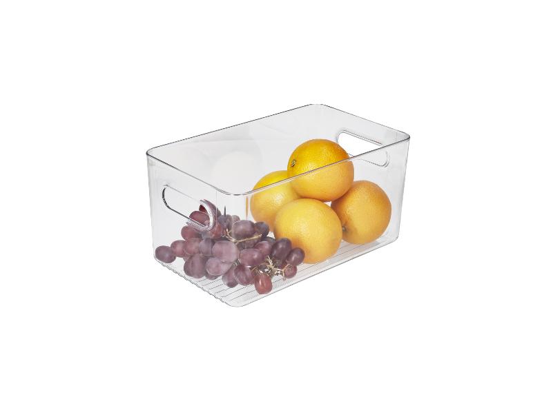 Transparante opbergdoos met druiven en sinaasappels.