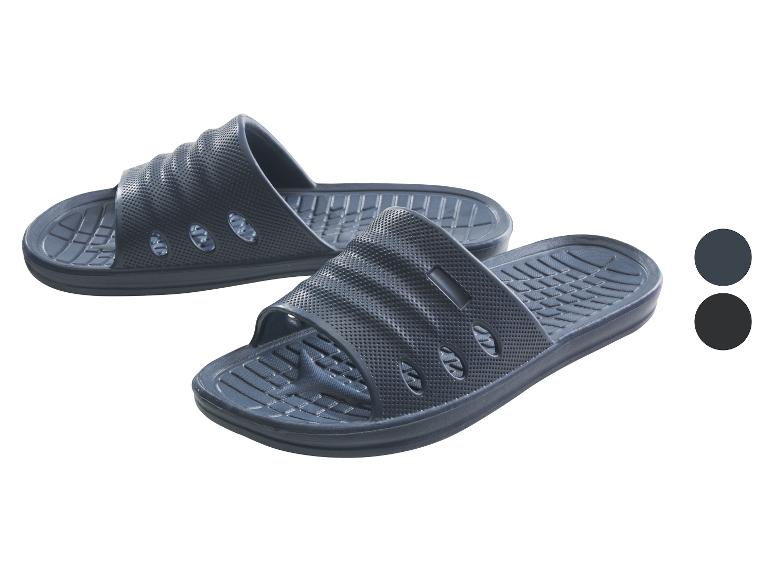 Twee paar donkergrijze zwembadslippers met een geperforeerde bovenzijde.