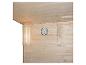 Sauna-interieur met houten wanden, thermometer en zandloper.