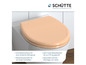 Een beige toiletbril van Schütte met een softclose mechanisme.