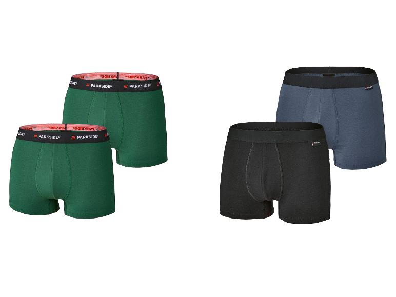 Vier Parkside boxershorts: twee groene met rode band, één zwarte en één blauwe met zwarte banden.
