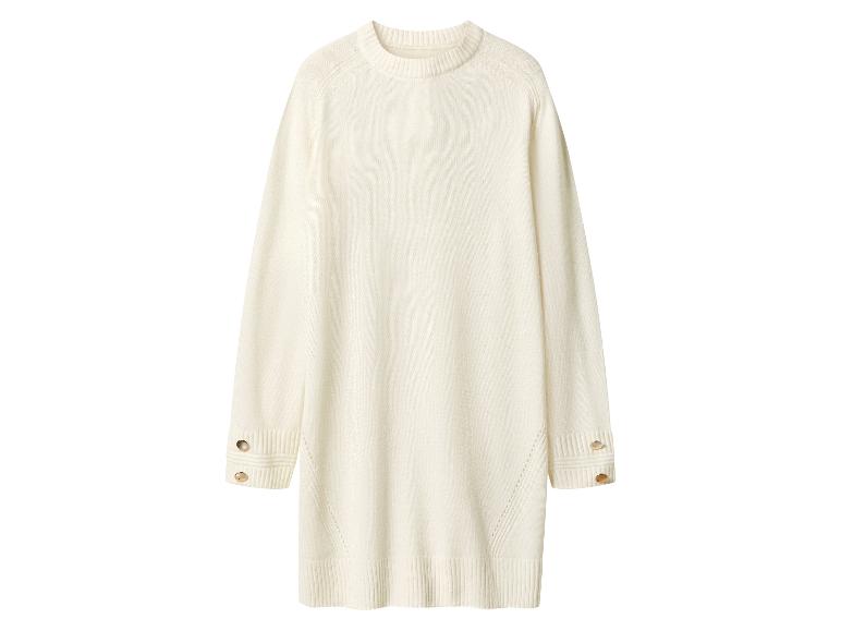 Crèmekleurige trui-jurk met lange mouwen en gouden knopen op de manchetten