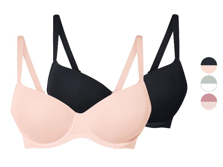 Twee bh's, één zwarte en één lichtroze.