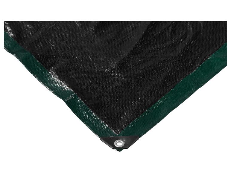 Close-up van een zwart dekzeil met een groene rand en een metalen oogje in de hoek.
