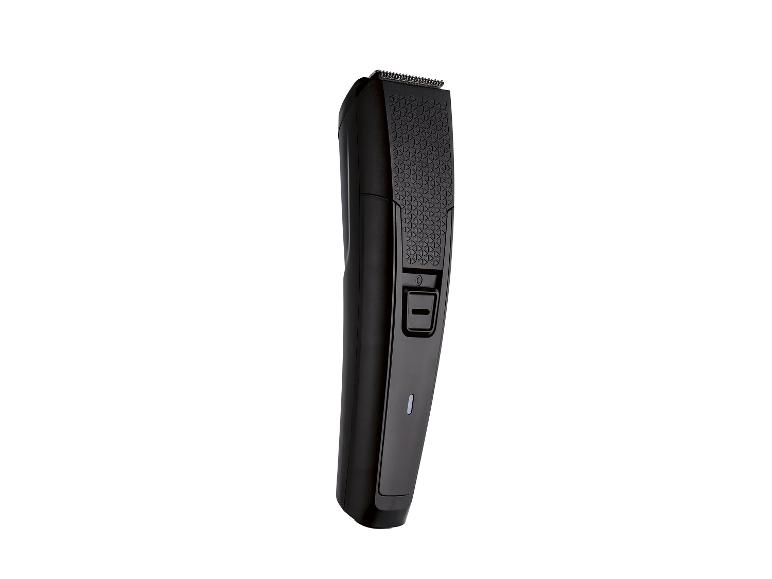 Zwarte haar- en baardtrimmer met aan/uit-knop en batterij-indicator.