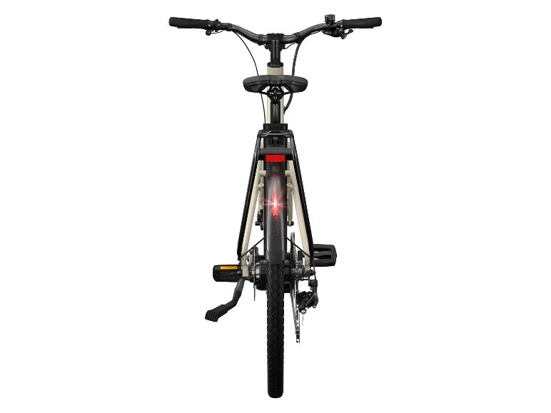 Achterkant van een beige fiets met zwarte onderdelen.