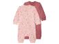 Twee babyrompertjes, één roze met sterren en één effen mauve.