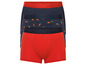 Drie boxershorts: één effen rood, één effen donkerblauw en één donkerblauw met pepers.