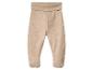 Beige babybroek met voetjes en brede elastische tailleband