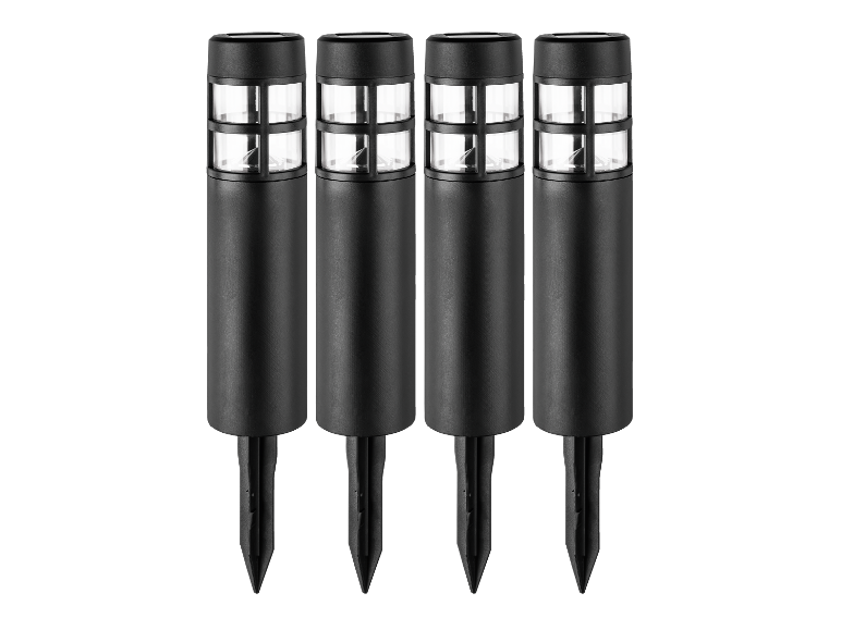 Vier zwarte solar tuinlampjes op een rij.