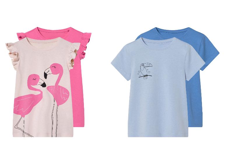 Twee shirts voor meisjes: een met flamingo's, de ander met een toekan.