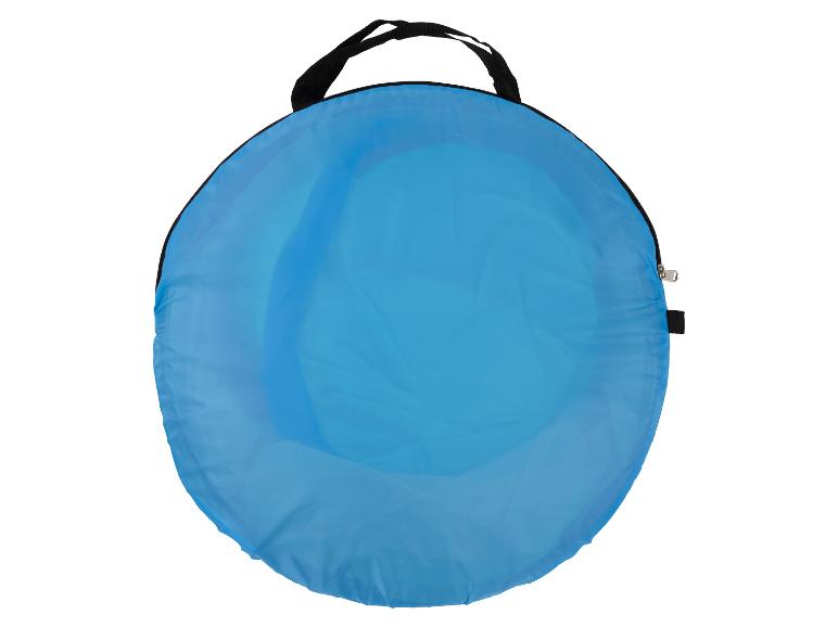 Blauwe pop-up tent opgevouwen in zijn draagtas.