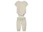 Babyset: rompertje en broek van beige mousseline.