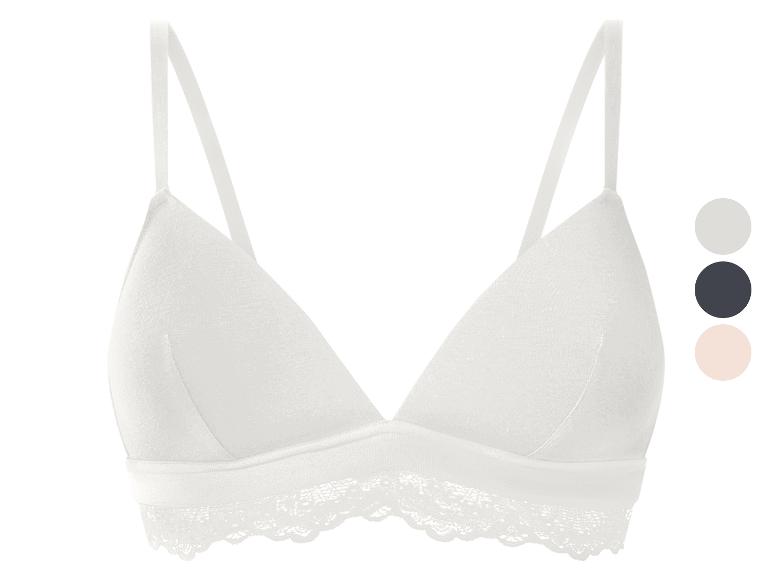 Witte kanten bralette met een kleurenpalet ernaast.