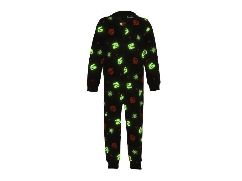 Zwarte Halloween-onesie met glow-in-the-dark dinoschedels, pompoenen, spinnen en spinnenwebben.