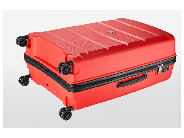 Rode koffer met vier wielen, ritssluiting en een cijferslot.