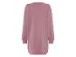 Roze sweaterjurk met lange mouwen.