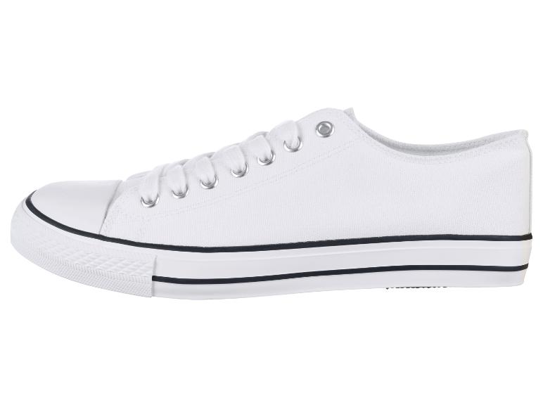 Witte canvas sneakers met zwarte streep.