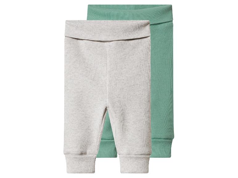 Twee geribbelde baby leggings, één lichtgrijs en één mintgroen.