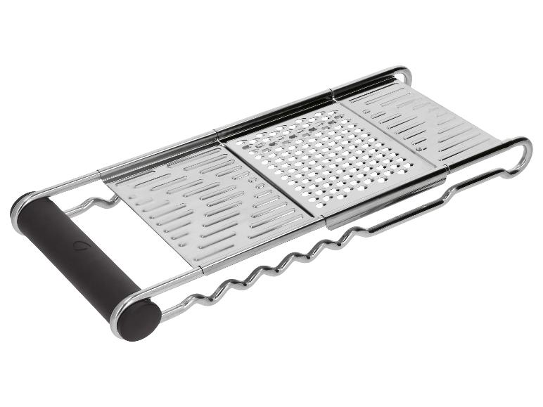 Metalen keukenrasp met zwart handvat, met drie verschillende raspoppervlakken.