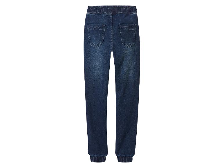 Donkerblauwe kinderjeans met elastische tailleband en enkelboorden.