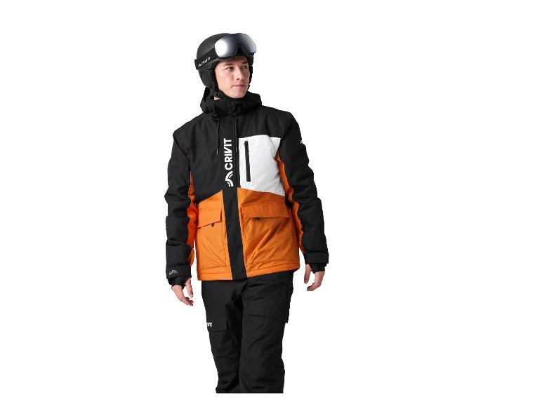 Man in zwart, oranje en wit ski-jack en zwarte skibroek