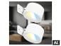 Twee witte wandspots met geel en blauw licht, in een wazig interieur.