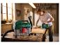 PARKSIDE® 20 V nat- en droogzuiger in een werkplaats met een decoupeerzaag.