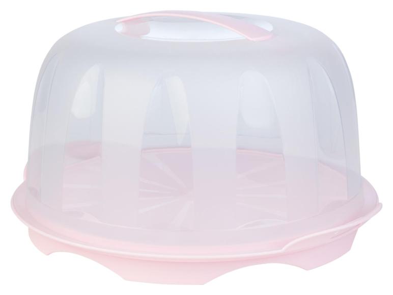 Een roze plastic cake-beschermer met deksel.