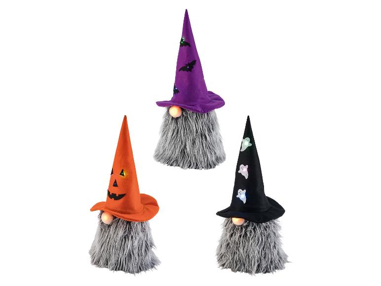 Drie Halloween decoratieve kabouters met oplichtende hoeden.