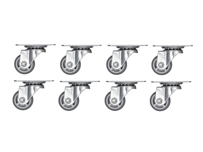 Acht zilveren wielen met grijze wieltjes, gerangschikt in twee rijen.