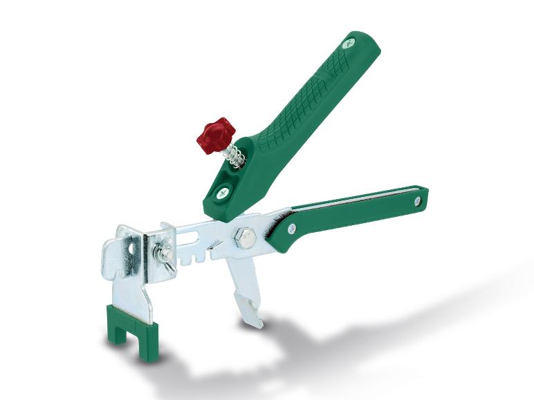 Een groene tegelklem voor het leggen van tegels.