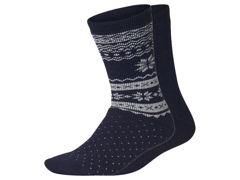 Paar marineblauwe sokken met wit fair isle-patroon en antislipnoppen