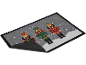 Kerstmat met drie notenkrakerfiguren in een besneeuwd landschap.