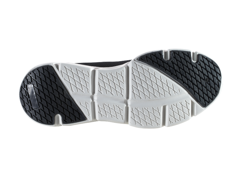 Zwarte zool van een sportschoen met wit patroon.