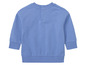 Een blauwe longsleeve met knopen