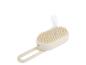 Beige hoofdhuidmassageborstel met stoom.