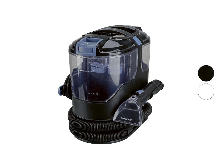 Zwarte tapijtreiniger met transparant waterreservoir en accessoires.