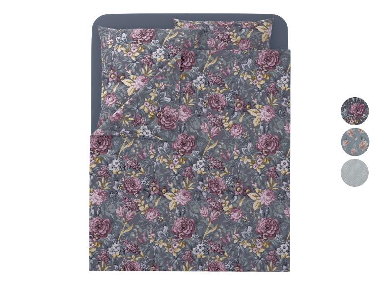 Grijs bloemen beddengoedset met kussens en dekbed, met designstalen.