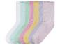 Zes paar pastelkleurige sokken met ruches.
