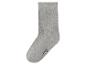 Grijze geribbelde sok met het nummer 27-30 op de teen