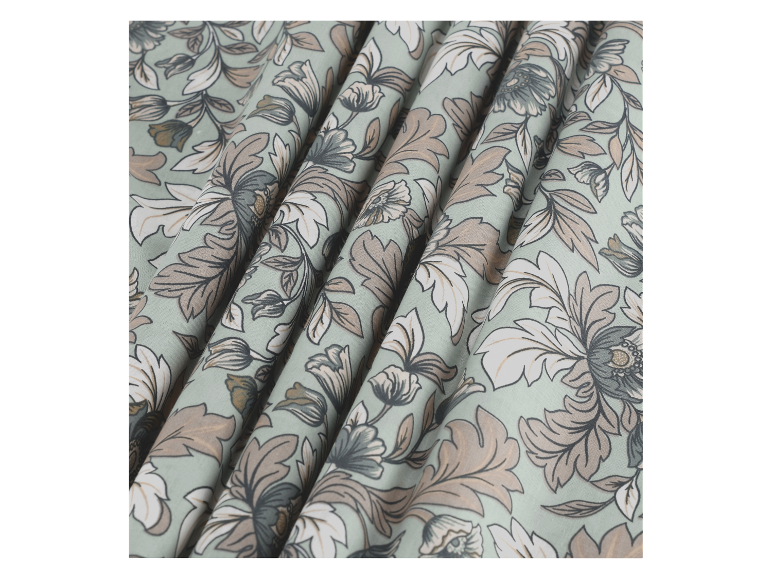 Gestoffeerd textiel met een bloemenpatroon in groene en beige tinten.