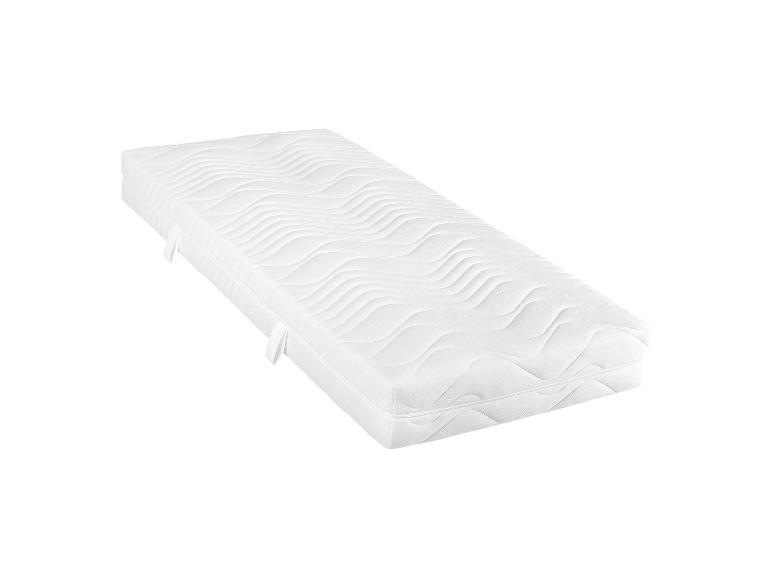 Een wit matras met golvende steek.