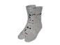 Twee paar grijze sokken met gereedschapsmotief.