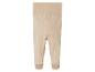 Beige babybroek met voetjes.