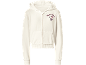 Crèmekleurige hoodie met rits, met cartoonfiguur en tekst.